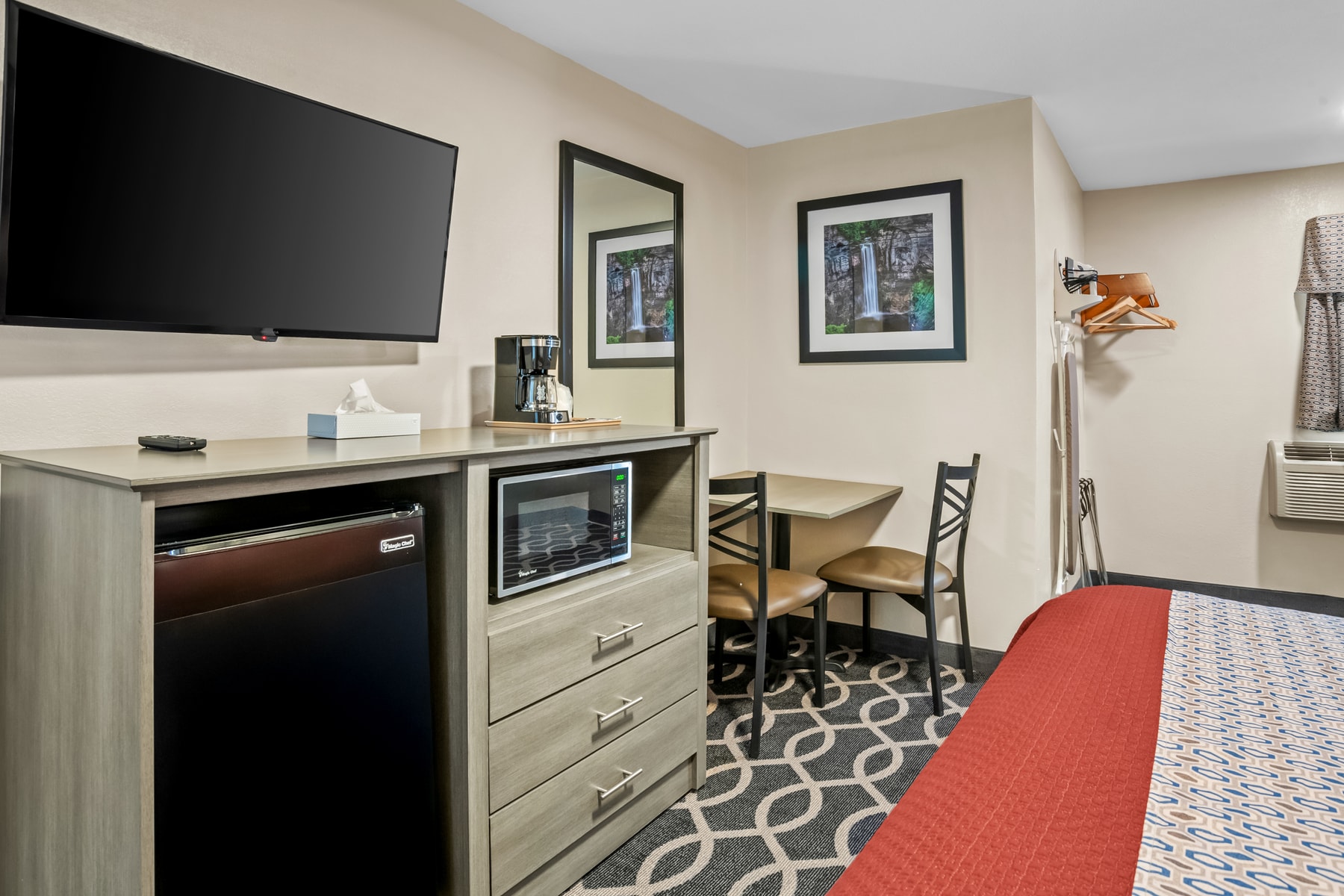 Guest room desk, microwave, and mini fridge